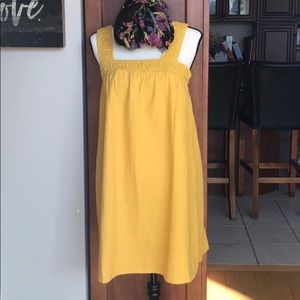 Mustard colored sleeveless knee length dress